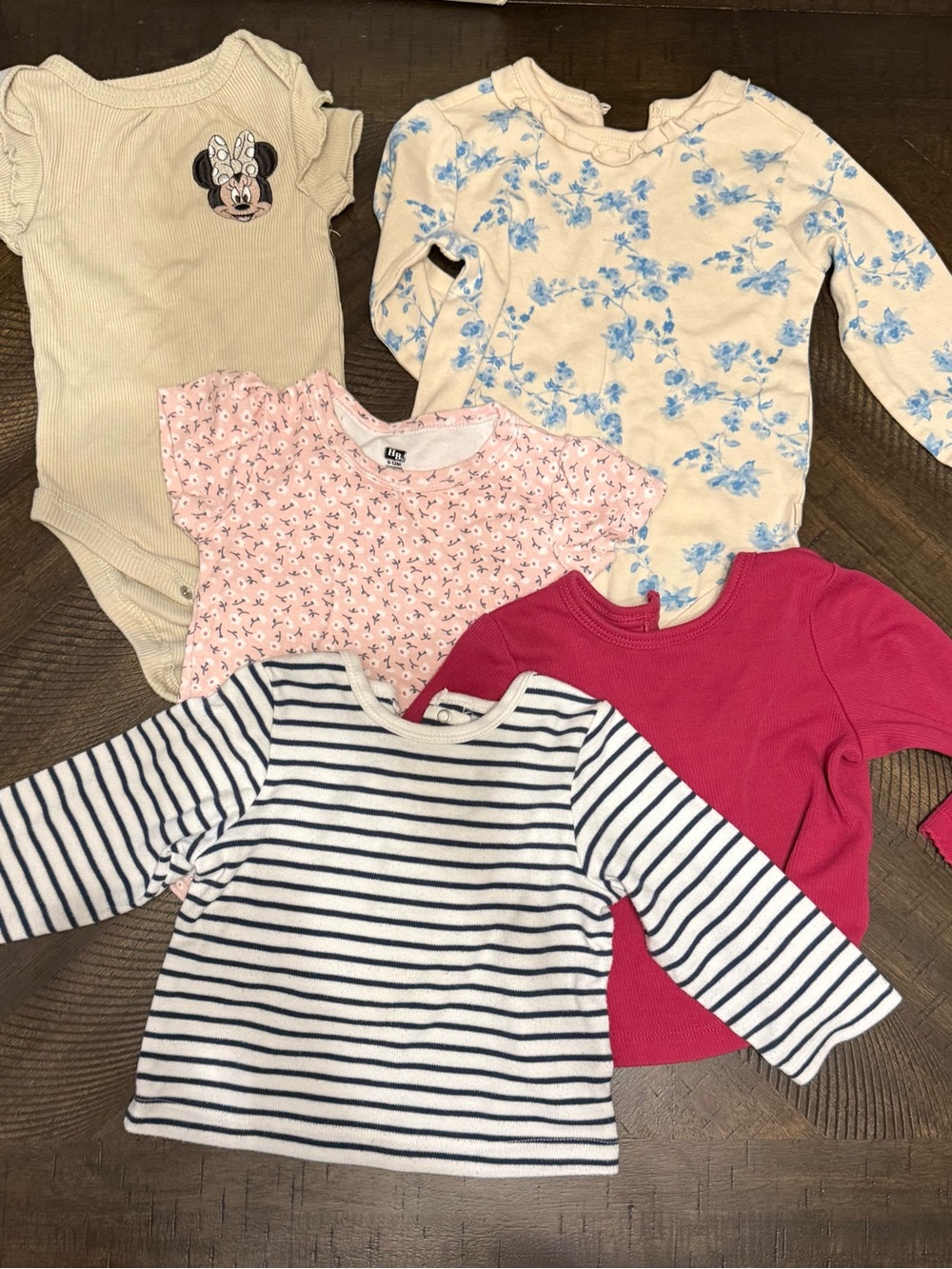 Mix of body suits and long sleeve shirts